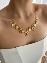GOLDEN HARMONY MULTI CHARM NECKLACE