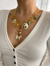 PEARL WINGS MULTI CHARM NECKLACE